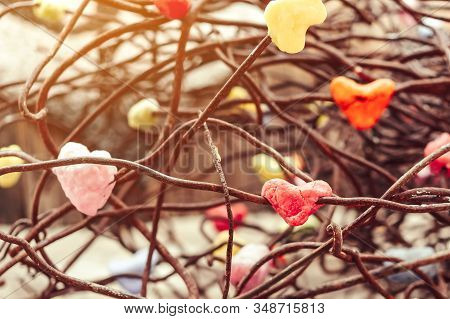 A Chunk Of A Red Heart Shaped Candle Adheres To An Old Rusted Steel Rod.  A Valentine's Day Backgrou