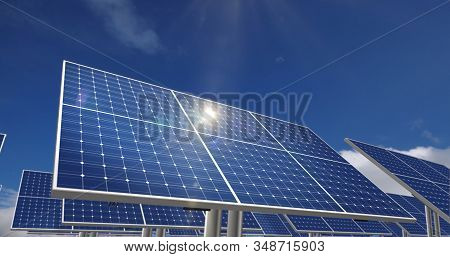 Solar Energy Panels With Sun Reflection And Blue Sky In Background. Green Power, Ecology, Clean And 