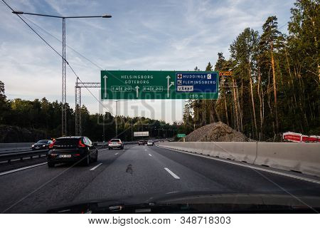 Editorial 08.31.2019 Stockholm Sweden Driving On The Motorway Out From The City With Sign Overhead W