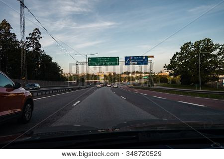 Editorial 08.31.2019 Stockholm Sweden Driving On The Motorway Out From The City With Sign Overhead W