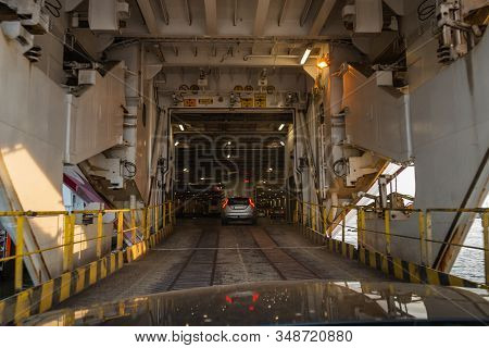 Bow Doors Are Open And Cars Are Driving Inside A Big Car Ferries Car Deck In The Port Of Turku Finla