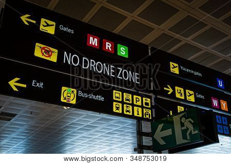 Information Panel With No Drone Flying Warning Sign On It At An International Airport.