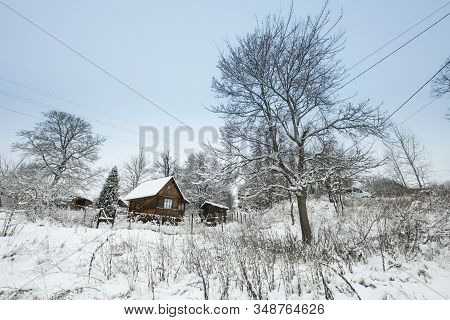 Blue Sky With Snow Field And House. Great Background With Copyspace. Winter And Snow Landscape. Stoc