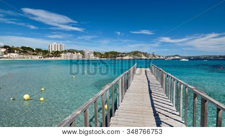 Empty Wooden Boardwalk Leading To Mediterranean Sea Clear Green Lagoon Bay Waters, Freedom, Vacation