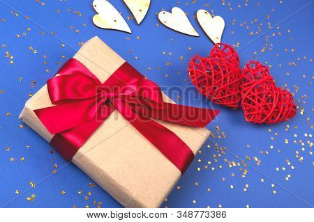 Beautiful Red And Wooden Hearts With A Present On The Cornflowerblue Background In The Golden Star S