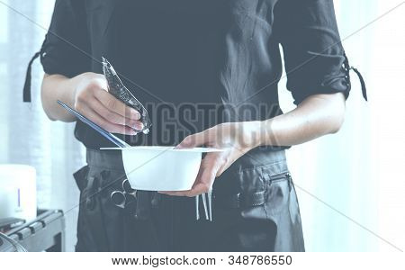 Hairdresser Prepairing To Dye Girls Hair In Beauty Salon