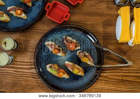 Meat Appetizers On French Loaf, With Tomato And Lettuce.