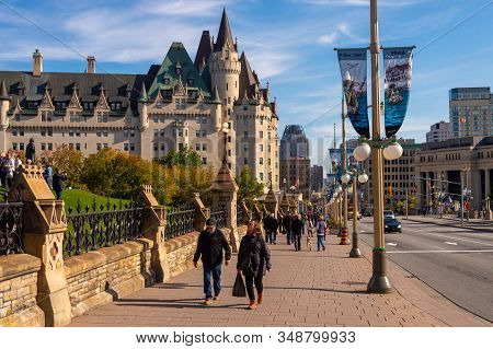 Ottawa, Ca - 9 October 2019:  People Walking On Wellington Street. Chateau Laurier In The Distance.