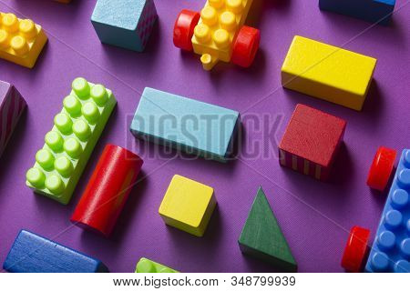 Colorful Kids Toys Frame On Wooden Background. Top View. Flat Lay. Copy Space For Text.