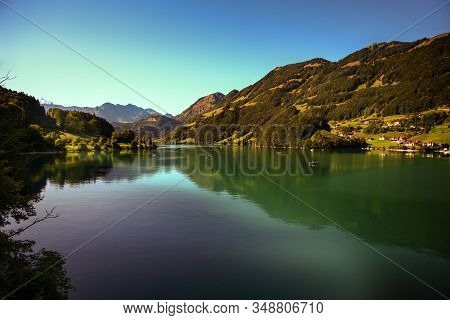 Lake Lungern Switzerland - Famous Fishing Lake In Switzerland.reflection In Water