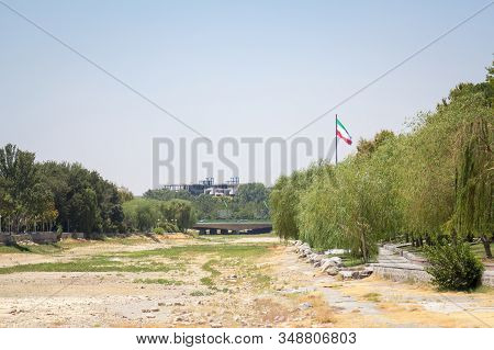 Flag Of The Islamic Republic Of Iran Waiving In Front Of The Zayandeh River, Dried Due To The Especi