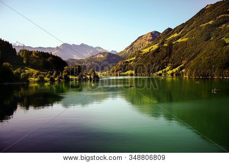 Lake Lungern Switzerland - Famous Fishing Lake In Switzerland. Reflection In Water