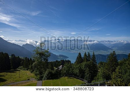 Swiss Alps Landscape Up In Rigi Kaltbad With Trees, Mountains And Blue Sky In Summer