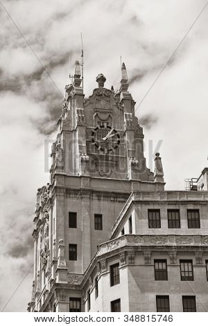 MADRID, SPAIN - MAY 13, 2018: Telefonica Building rise above historical buildings on Gran Via business district.