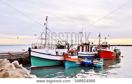 Seascape With Fishing Boats In A Small Harbor