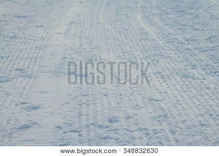 Rribbed Footprint In Snow Left Snowcat. Preparation Of Ski Slopes. The Concept Of Snow Removal, Ski 
