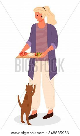 Woman Hold Cutting Board With Sliced Vegetables For Cooking Food. Cat Jumping And Begging Food From 
