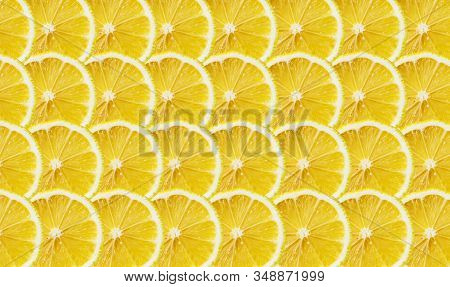 Juicy Yellow Slice Of Lemon Fruit Pattern Background, Flat Lay. Lemon Decoration.