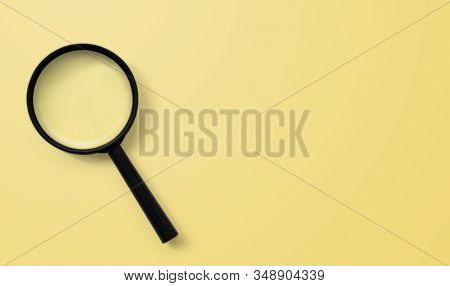 Magnifying Glass On Yellow Colour Background. Searching Information Data Concept