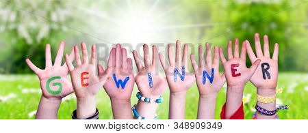 Children Hands Building Word Gewinner Means Winner, Grass Meadow