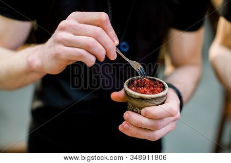 A Man Prepare Hookah Sisha In Hookah Bar. Tabaco Preparation.