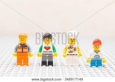 Kouvola, Finland - 18 December 2019: Friendship Of Lego Minifigures Staying On Gray Baseplate