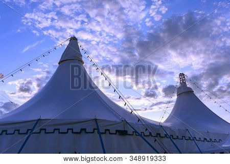 Circus Tent With Two Towers. Big Top Circus. The Image Of A Circus On A Background Of Blue Sky.