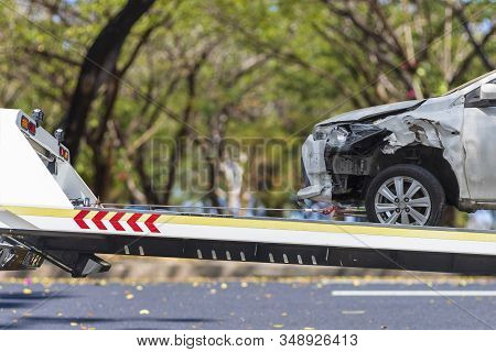 Accident Car Slide On  Truck For Move. Gray Car Have Damage By Accident On Road Take With Slide Truc