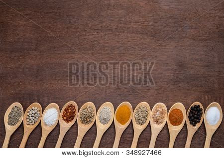 Various Spices In Wooden Spoon On Wood Table Background, Sugar, Pepper, Salt, Turmeric, Rosemary, Or