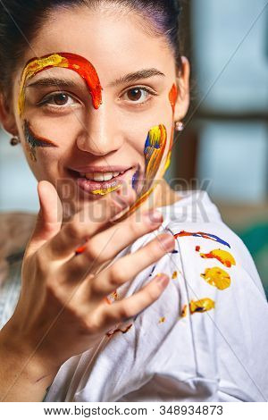 Beauty Art Concept, Portrait Of A Young Girl Painted With Different Colors Of Paint. Color Demos, Co
