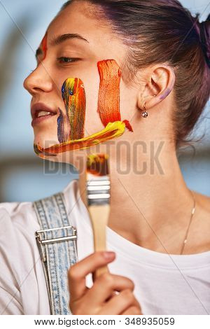 Beauty Art Concept, Portrait Of A Young Girl Painted With Different Colors Of Paint. Color Demos, Co