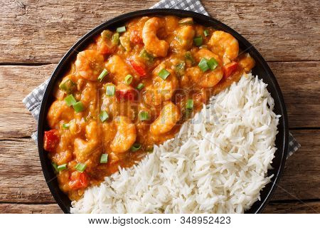 Spicy Traditional Shrimp Etouffee With Celery, Onion And Pepper With Sauce Served With Rice Closeup