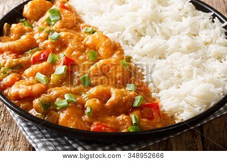 Louisiana Shrimp Etouffee With Vegetables Cooked In Roux Sauce Served With Rice Closeup In A Plate.