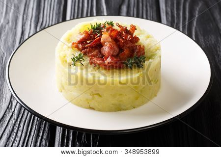 Recipe For A Traditional Trinxat Mashed Potato And Green Cabbage With Fried Bacon Closeup In A Plate
