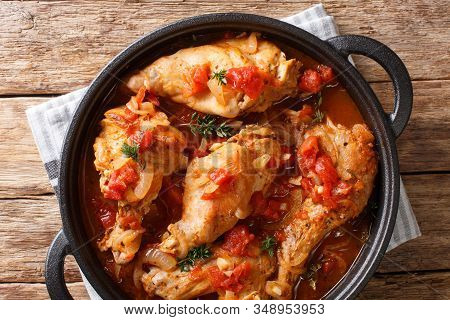 Andorra Recipe Stew Of Rabbit In Tomato Sauce With White Wine And Herbs Close-up In A Pan. Horizonta