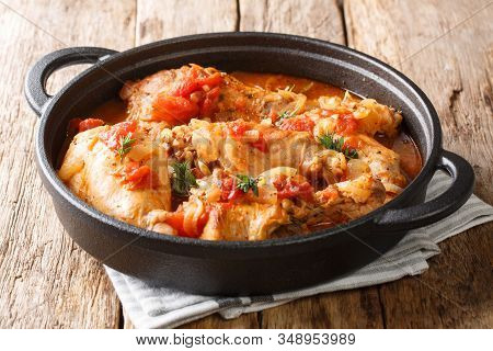 Tasty Spicy Rabbit Stew In Tomato Sauce With White Wine And Herbs Close-up In A Pan. Horizontal
