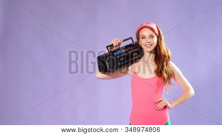Girl Fitness Trainer Listens To Music After A Good Workout.
