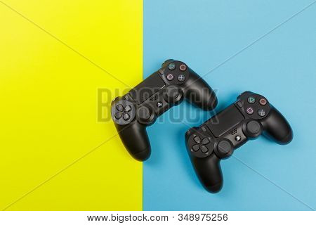 Russia, Oktober 24 2019: Computer Game Competition. Gaming Concept. Joysticks Isolated On Color Back