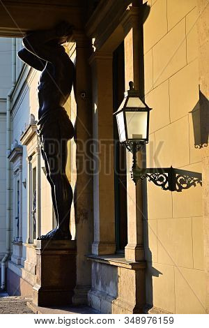 Saint Petersburg, Russia - January 31, 2020: Atlas (atlant) Granite Sculpture Of A Man Supporting Co