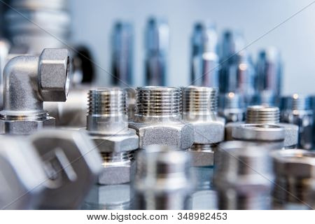 Hosepipe Fittings On The Table. Plumbing Pipeline Spare Parts.