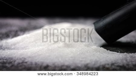 Sucking Sugar Or Salt Of A Table. Deadly And Toxic Food. Obesity And Diabetes Epidemic