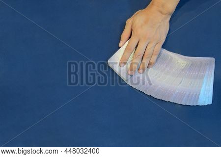 Close-up Left Hand Of Fortune Teller Who Slitting Tarot Cards For Predict The Fate And Future Next S