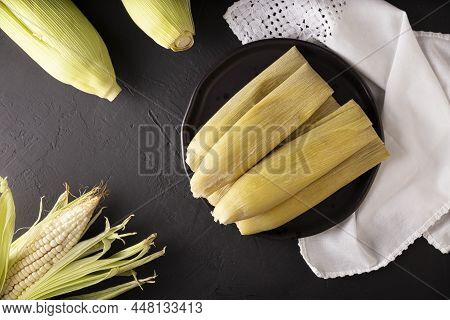 Tamales De Elote, Also Called Uchepos. Typical Mexican Dish. Can Be Served With Green Salsa And Acco