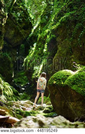 Young Girl Hiking In Botro Ai Buchi Del Diavolo, Rocky Gorge Hiking Trail, Leading Along Dried Up Ri
