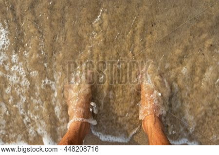Human Feet Feeling Nature Isolated On Sandy Beach Showing The Human Love Of Nature. The True Express