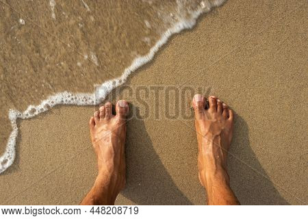 Human Feet Feeling Nature Isolated On Sandy Beach Showing The Human Love Of Nature. The True Express