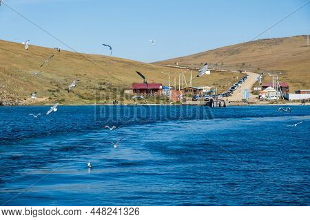 Ferry Dock On The Island Of Olkhon With Seagulls. Baikal Lake In Autumn. Strait Olkhonskie Vorota An