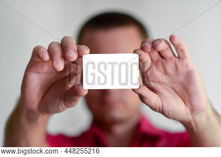 A Credit Or Business Card In Mens Hands.