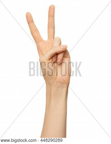 Female Hand Show Number Two, 2 Finger Isolated On White. Women Hand Show Sign Victory Or V Symbol