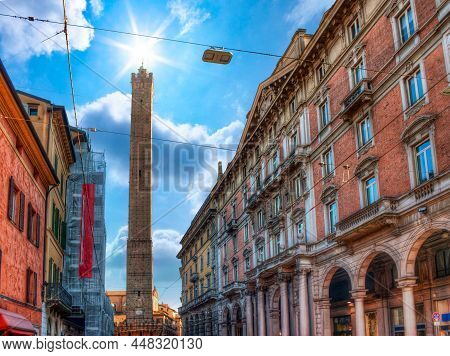 View Of The Asinelli Tower, In The City Of Bologna, Italy,  Seen From Via Rizzoli, In A Sunny Day